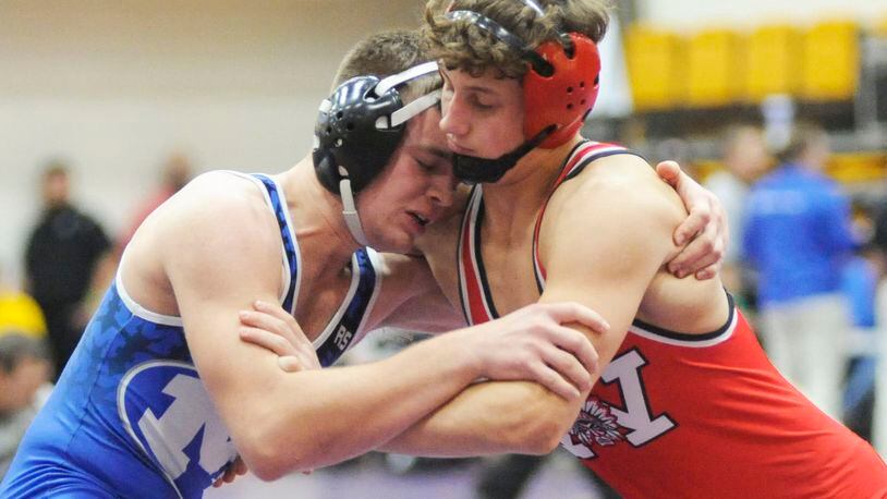 Cameron Carnevale of Miamisburg (left) and Austin Mullins of Wayne were matched in the opening day of the GMVWA Holiday wrestling tournament at Butler last month. The Miamisburg Invitational scheduled for Saturday, Jan., 12, has been canceled. MARC PENDLETON / STAFF