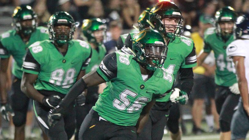 Northmont defenders Phillip Quansah (56) and Shaun Myers (44) celebrate a stop. Northmont defeated visiting Fairmont 28-14 in a Week 3 high school football game on Friday, Sept. 13, 2019. MARC PENDLETON / STAFF