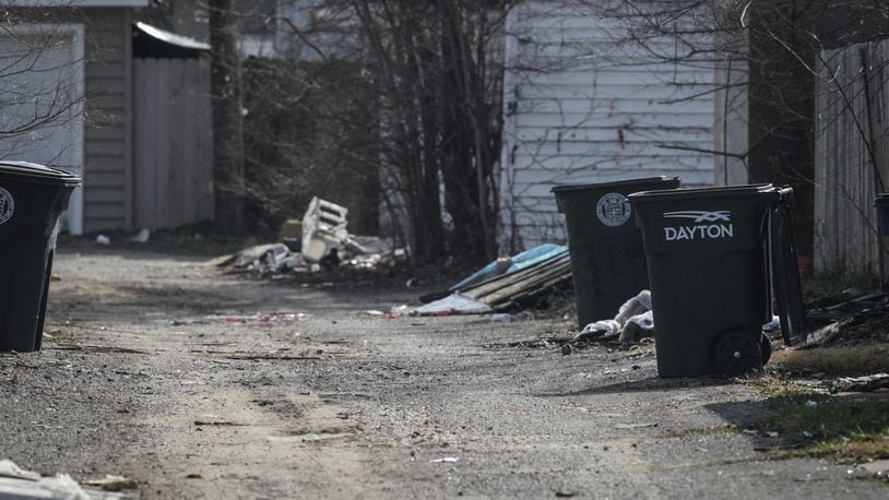 Police continue to investigate what led to a Darke County teenager found in an alley on South Erwin St. in Dayton last month and who later died. JIM NOELKER/STAFF