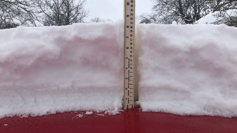 About 8.5 inches of snow fell in central Kettering from Saturday morning through Sunday morning. JEREMY P. KELLEY / STAFF