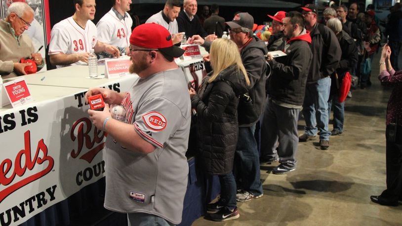 Reds fans getting autographs at the winter caravan stop at the National Museum of the U.S. Air Force in 2017. FILE
