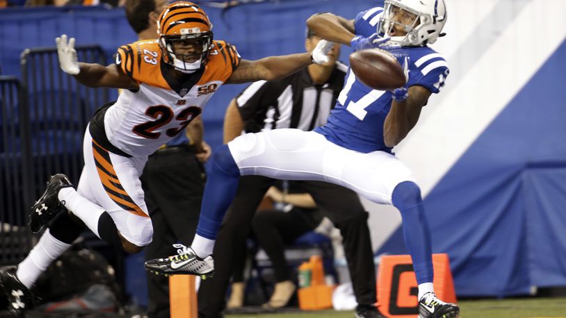 Indianapolis Colts wide receiver Justice Liggins (17) makes a catch in front of Cincinnati Bengals cornerback Bene Benwikere (23) for a touchdown during the second half of a preseason NFL football game in Indianapolis, Thursday, Aug. 31, 2017. (AP Photo/AJ Mast)