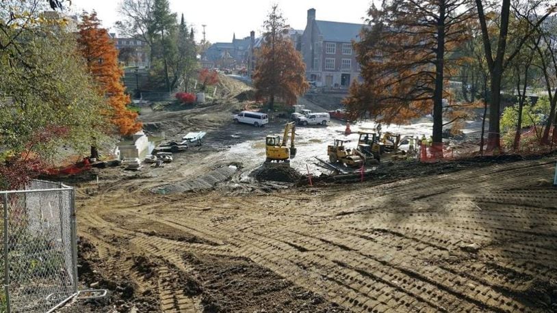 Construction crews have removed the concrete sides and brick bottom of Mirror Lake on the Ohio State University campus. Workers are installing new utilities, and the renovation is expected to be completed in spring. KYLE ROBERTSON/THE COLUMBUS DISPATCH