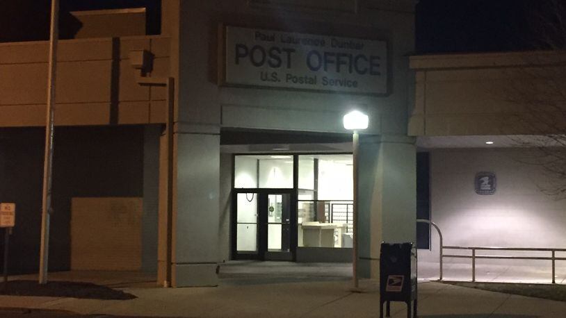 Dayton police are investigating a report that a letter carrier was robbed at gunpoint by two juveniles at this post office late Thursday afternoon, Jan. 19, 2017. (Jarod Thrush/Staff)