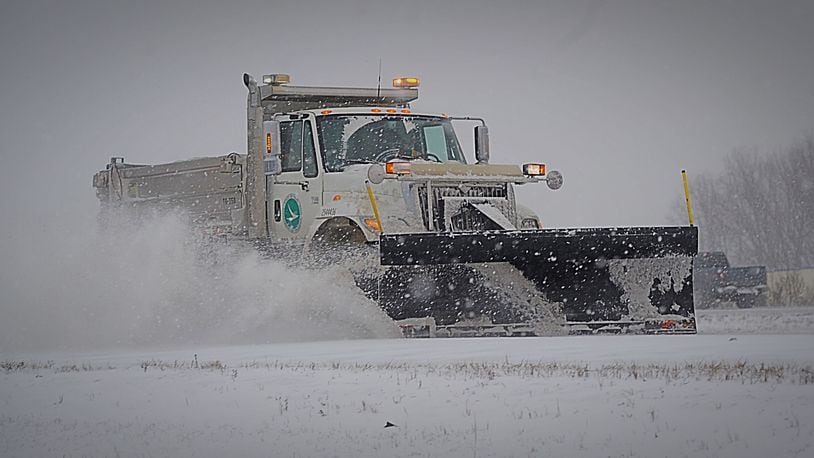 ODOT trucks plowing and salting Interstate 675 in Greene County  Feb. 15, 2021. MARSHALL GORBY/STAFF