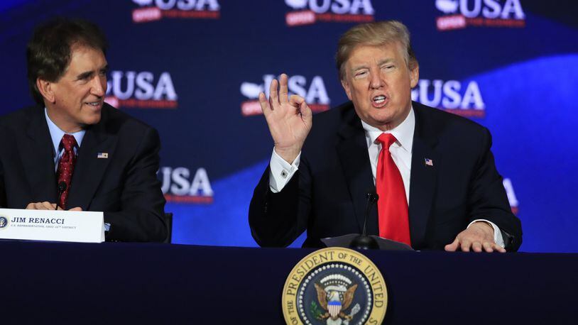 President Donald Trump speaks during a roundtable discussion on tax reform at the Cleveland Public Auditorium and Conference Center in Cleveland, Ohio, Saturday, May 5, 2018. At right is Rep. Jim Renacci, R-Ohio. (AP Photo/Manuel Balce Ceneta)