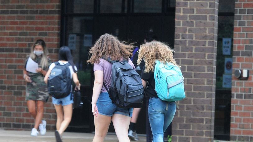 Students enter Bellbrook High School in August as the district returned to in-person classes. MARSHALL GORBY\STAFF