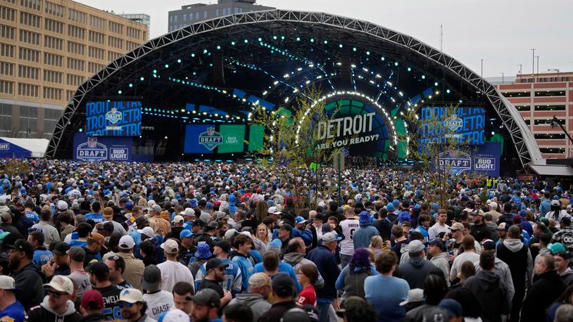 Crowds fill an area outside of the draft stage during the second round of the NFL football draft, Friday, April 26, 2024, in Detroit. (AP Photo/Carlos Osorio)