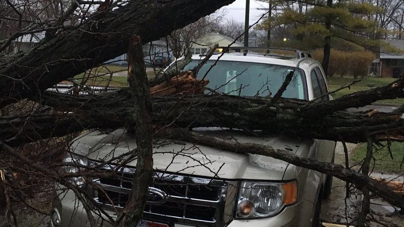 Just before 6 a.m. Wednesday on Oakridge Drive in Dayton, a tree fell on an SUV owned by Lita Campbell. STAFF PHOTO