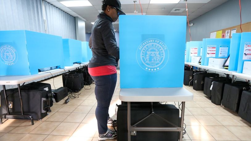 Yolanda Norman of Dekalb County uses te new voting machines at Voter Registration and Elections Office in Atlanta on Monday, March 2, 2020.