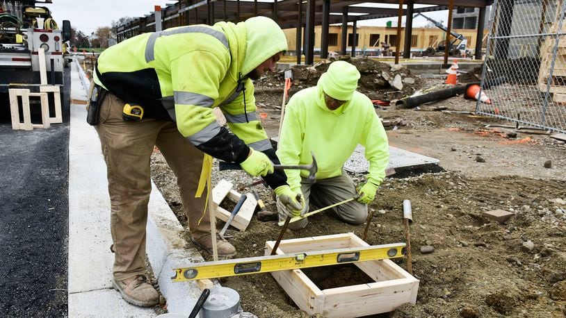 Construction workers on the job in Hamilton. Those in labor jobs, particularly construction, are more likely to die of opioid overdoses than any other profession in Ohio. NICK GRAHAM/STAFF
