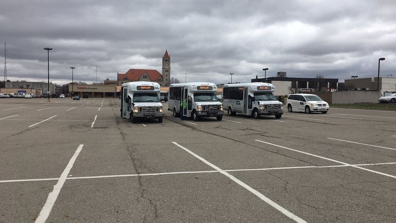 Greene CATS buses now park in the middle of the city-owned parking lot after their no-rent lease with Blue Rock Investments, LLC was terminated. RICHARD WILSON/STAFF
