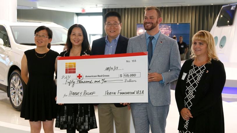 The Heren Foundation America, the charitable arm of Fuyao Global and Fuyao founder Cho Tak Wong, announced a $50,000 donation to the Dayton Area Chapter of the American Red Cross Thursday. From left to right are Lei Shi, the executive assistant of Heren Foundation America, Sunny Sun, vice-president with Fuyao and chair of the foundation board, Jeff Liu, president of Fuyao Glass America, Cory Paul, executive director of the Red Cross Dayton chapter and Laura Shepherd, regional philanthropy officer with the Red Cross. LISA POWELL / STAFF
