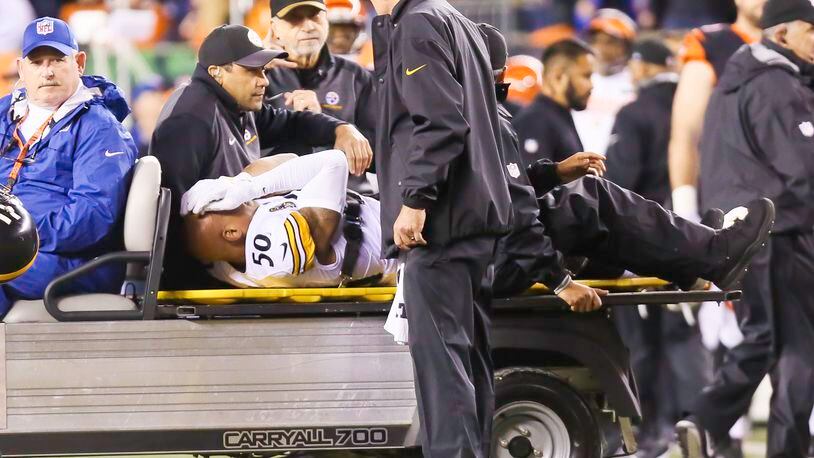 Steelers linebacker Ryan Shazier is injured on a catch by Bengals wide receiver Josh Malone (80) during the first half of their game at Paul Brown Stadium, Monday, Dec. 4, 2017. GREG LYNCH / STAFF