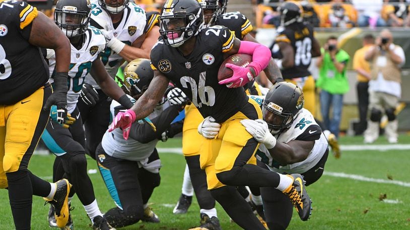 PITTSBURGH, PA - OCTOBER 08: Le'Veon Bell #26 of the Pittsburgh Steelers rushes against the Jacksonville Jaguars in the first quarter during the game at Heinz Field on October 8, 2017 in Pittsburgh, Pennsylvania. (Photo by Justin Berl/Getty Images)