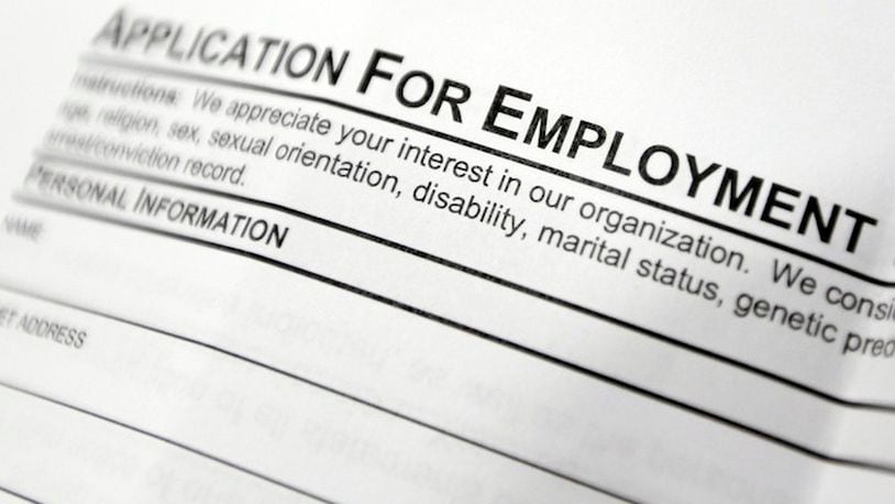 This April 22, 2014, file photo shows an employment application form on a table at a job fair in Hudson, N.Y. Middle-age white Americans with limited education are increasingly dying younger, on average, than other middle-age U.S. adults, a trend driven by their dwindling economic opportunities, research by two Princeton University economists has found. The economists, Anne Case and Angus Deaton, argue in a paper released Thursday, March 23, 2017, that the loss of steady middle-income jobs for those with high school degrees or less has triggered broad problems for this group. (AP Photo/Mike Groll, File)