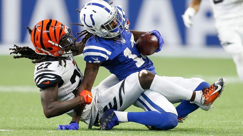 Cincinnati Bengals defensive back Dre Kirkpatrick (27) hauls down Indianapolis Colts wide receiver T.Y. Hilton (13) in the second half on Sunday, Sept. 9, 2018 at Lucas Oil Stadium in Indianapolis, Ind. The Indianapolis Colts lost 34-23 to the Cincinnati Bengals. (Sam Riche/TNS)