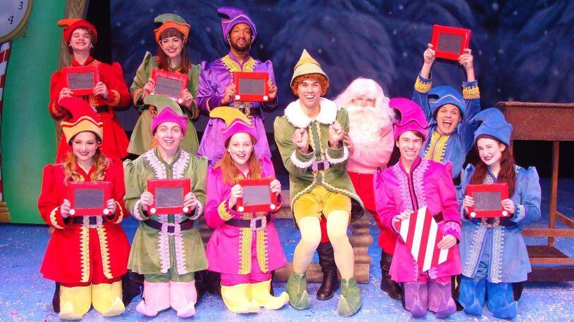 David Thomas (center as Buddy) and the cast of La Comedia Dinner Theatre's production of "Elf: The Musical," continuing through Dec. 31 in Springboro. CONTRIBUTED/JUSTIN WALTON