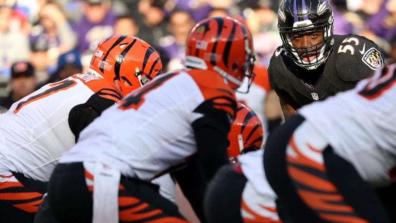 BALTIMORE, MD - NOVEMBER 27: Outside linebacker Terrell Suggs #55 of the Baltimore Ravens looks on while quarterback Andy Dalton #14 of the Cincinnati Bengals stands at the line of scrimmage in the second quarter at M&T Bank Stadium on November 27, 2016 in Baltimore, Maryland. (Photo by Patrick Smith/Getty Images)