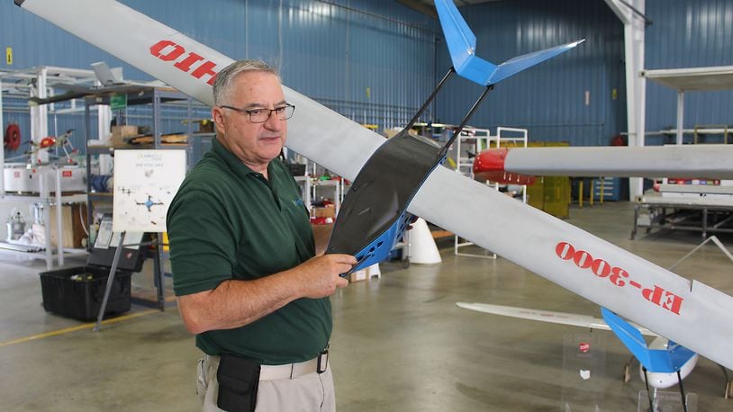 Frank Beafore, executive director at SelectTech Geospatial, in Springfield holds a EP-3000 drone. The Air Force Material Command at Wright-Patterson Air Force Base spent more than $13.9 million with his firm during fiscal year 2016. JEFF GUERINI/STAFF