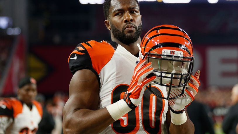 Bengals defensive end Michael Johnson celebrates Father's Day year-round, and often on the family farm near Selma, Ala., with Samuel Johnson.