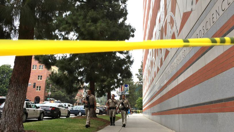 Sheriff deputies work at the scene of a fatal shooting at the University of California, Los Angeles, Wednesday, June 1, 2016, in Los Angeles. (AP Photo/Ringo H.W. Chiu)