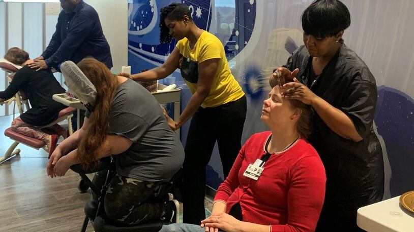 On December 30, employees for Infinitee Salon and Spa giving massages and facials to parents and guardians at Dayton Children’s Hospital. SARAH CAVENDER/STAFF PHOTO