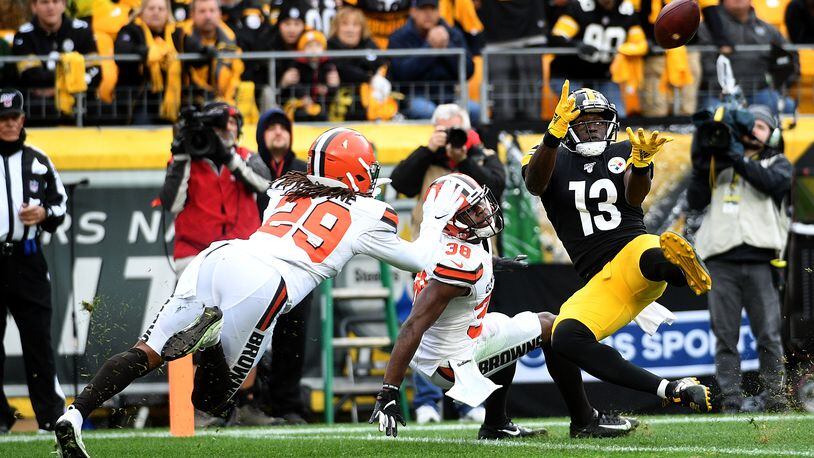 PITTSBURGH, PA - DECEMBER 01: James Washington #13 of the Pittsburgh Steelers makes a catch in front of Sheldrick Redwine #29 of the Cleveland Browns for a 30-yard touchdown reception in the second quarter at Heinz Field on December 1, 2019 in Pittsburgh, Pennsylvania. (Photo by Justin Berl/Getty Images)