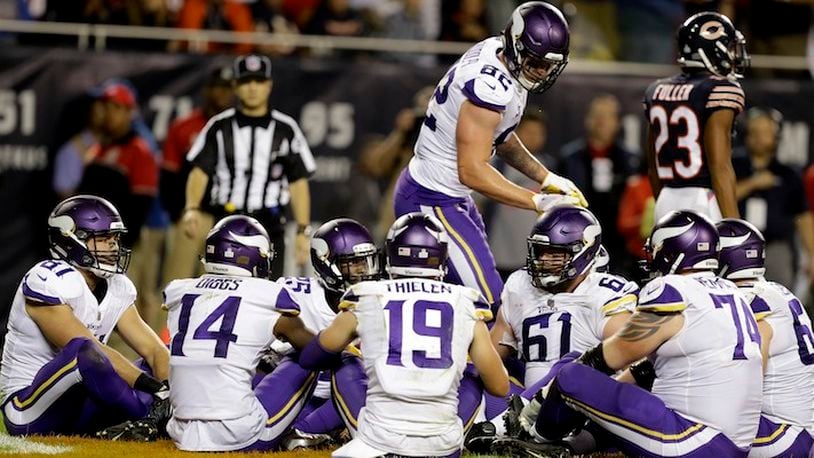 Minnesota Vikings tight end Kyle Rudolph (82) celebrates a touchdown with his teammates during the second half of an NFL football game against the Chicago Bears, Monday, Oct. 9, 2017, in Chicago. (AP Photo/Darron Cummings)
