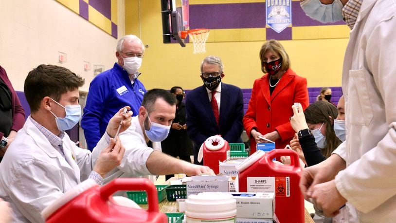 Gov. Mike DeWine and his wife, Fran, visit a COVID-19 vaccination clinic at Thurgood Marshall High School in Dayton on Sunday/ CONTRIBUTED