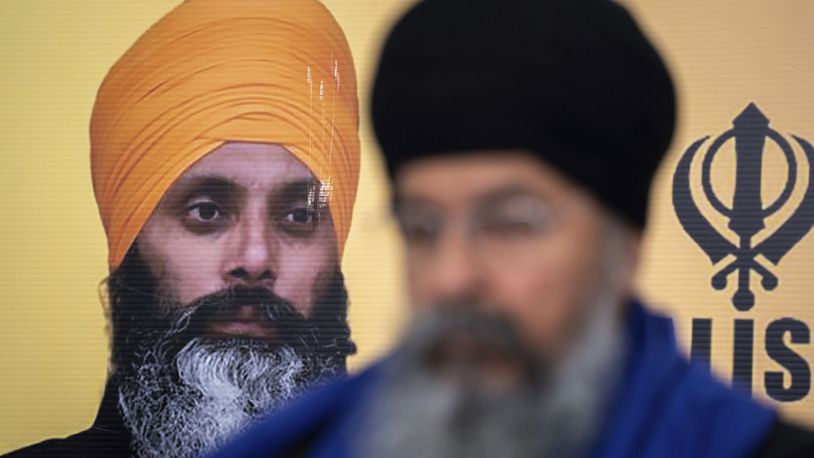 A photo of Hardeep Singh Nijjar is seen during a news conference providing an update from the Sikh community about Nijjar's homicide from June 18, 2023 in Surrey, B.C. on Friday, May 3, 2024. (Ethan Cairns/The Canadian Press via AP)