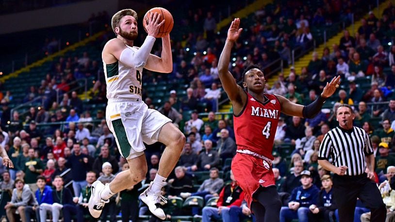 Miami’s Isaiah Coleman-Lands defends Wright State’s Alan Vest during Wednesday night’s game at the Nutter Center. Coleman-Lands hit a buzzer-beating 3-pointer to lift the RedHawks past Wright State, 65-62. CONTRIBUTED PHOTO