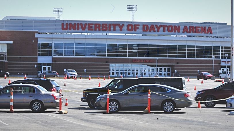 Cars are lined up for the first day of antibody testing available at the University of Dayton Arena test collection site in conjunction with Premier Health and CompuNet Labs Monday, April 4, 2020. MARSHALL GORBY / STAFF