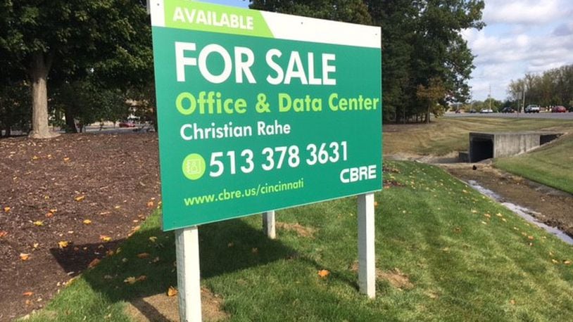 A CBRE "for sale" sign is posted at an entrance to the LexisNexis campus in Miami Twp. THOAMS GNAU/STAFF