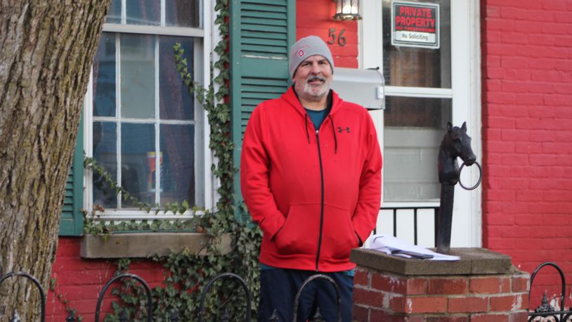 Greg Soete stands outside his home on Drummer Avenue in the Newcombs Plain neighborhood in east Dayton. Soete applied for two parcels through Lot Links in mid-2016 to turn into a side yard and garden but is still waiting for the properties to be transferred to him. CORNELIUS FROLIK / STAFF