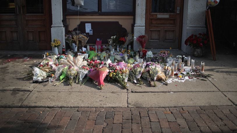 FILE PHOTO: A memorial to those killed in a mass shooting sits along the sidewalk in the Oregon District on Aug. 06 in Dayton, Ohio. Nine people were killed and another 27 injured when a gunman opened fire in the popular entertainment district.