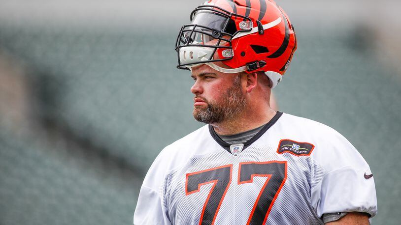 Cincinnati Bengals offensive tackle Andrew Whitworth watches from the sidelines during a break on the first day of mandatory mini camp Tuesday, June 14 at Paul Brown Stadium in Cincinnati. NICK GRAHAM/STAFF