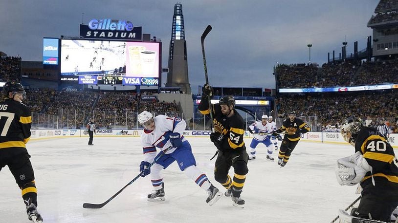 Boston Bruins' Tuukka Rask (40) makes a save as Adam McQuaid (54) defends against Montreal Canadiens' Brendan Gallagher (11) during the third period of the NHL Winter Classic hockey game at Gillette Stadium in Foxborough, Mass., Friday, Jan. 1, 2016. The Canadiens won 5-1. (AP Photo/Michael Dwyer)