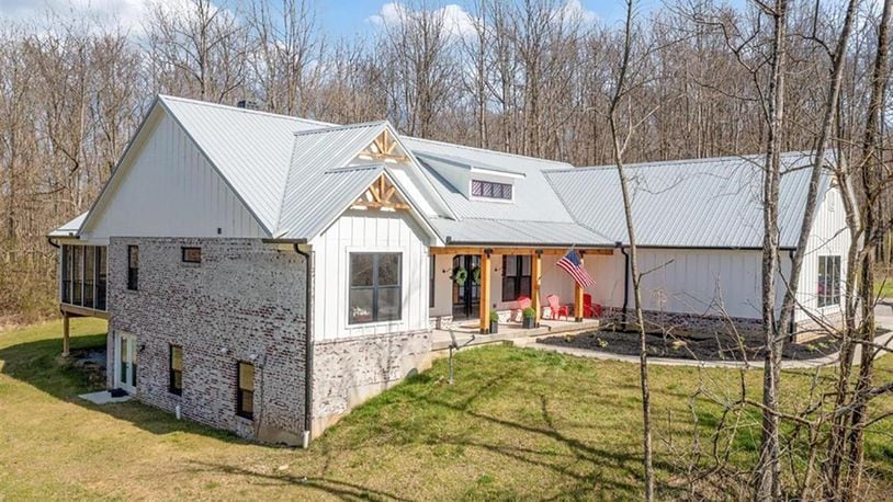 Surrounded by 11.02 acres, this farmhouse chic ranch was built in 2020 and has an open concept floor plan with a full, finished, walk-out lower level. The 6-bedroom home has about 4,575 sq. ft. of living space and a 3-car garage. CONTRIBUTED PHOTO