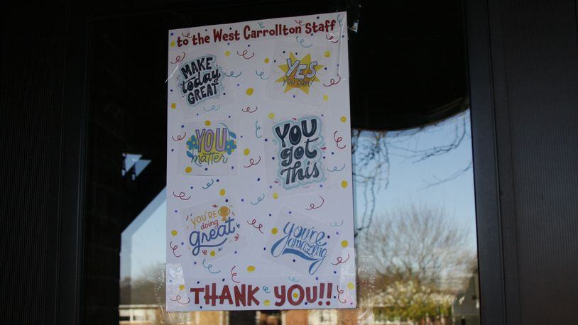 The West Carrollton School District is investigating a mystery. Someone left signs for staff on all the school doors with uplifting notes and a thank you. CONTRIBUTED