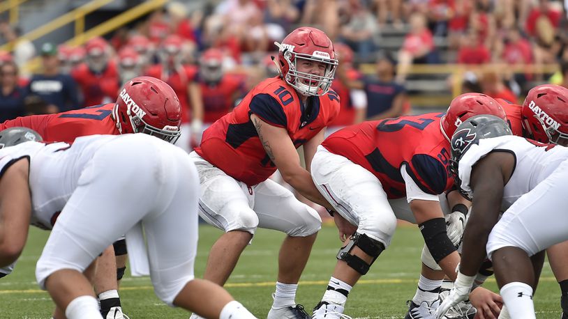 Dayton quarterback Jack Cook, pictured here vs. Robert Morris earlier this season, passed for a career high 432 yards Saturday in a loss at San Diego. Erik Schelkun/CONTRIBUTED