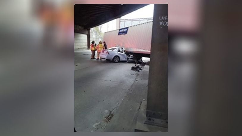 A 12-year-old and her mother are continuing to recover from a crash earlier this month when a storage unit fell from a semi truck crushing their car on Ohio 4 at the train trestle overpass in Fairfield. CONTRIBUTED