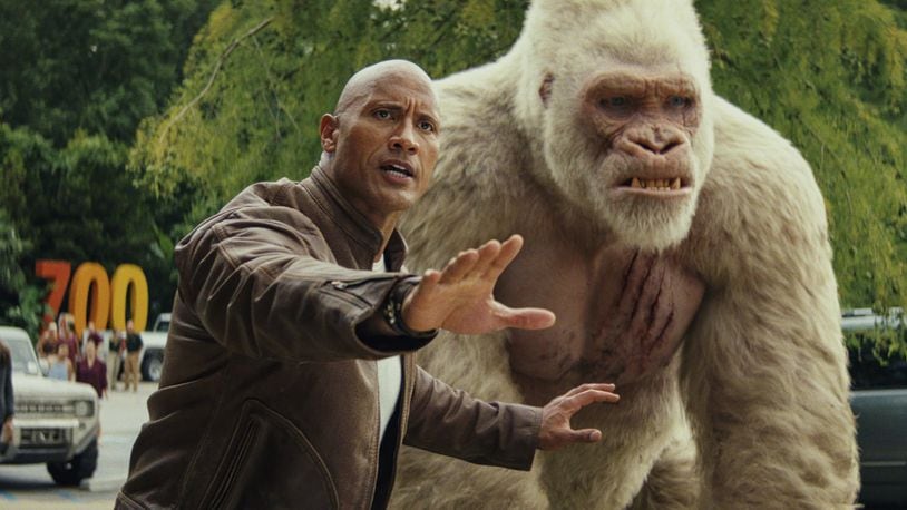 Dwayne Johnson (left) as Davis Okoye and Jason Liles as George in “Rampage.” Contributed by Warner Bros. Pictures