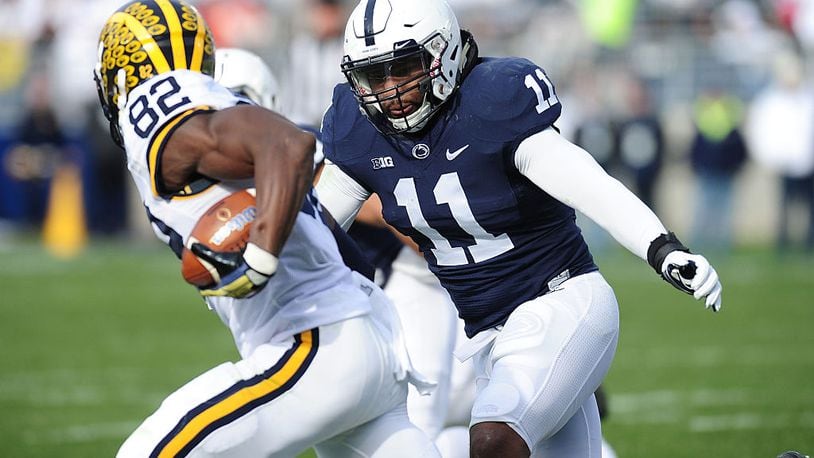STATE COLLEGE, PA - NOVEMBER 21: Brandon Bell #11 of the Penn State Nittany Lions tackles Amara Darboh #82 of the Michigan Wolverines in the second quarter at Beaver Stadium on November 21, 2015 in State College, Pennsylvania. (Photo by Evan Habeeb/Getty Images)