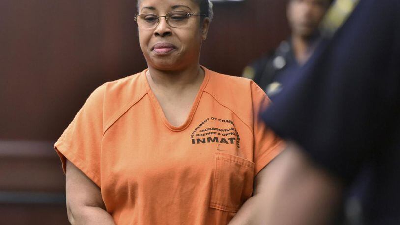 Gloria Williams enters the courtroom for her sentencing hearing, Friday, June 8, 2018, at the Duval County Courthouse in Jacksonville, Fla. Williams, who kidnapped a newborn from a Florida hospital two decades ago and raised the child as her own, was sentenced Friday to 18 years for kidnapping. She will also serve five years concurrently on a charge of custody interference.
