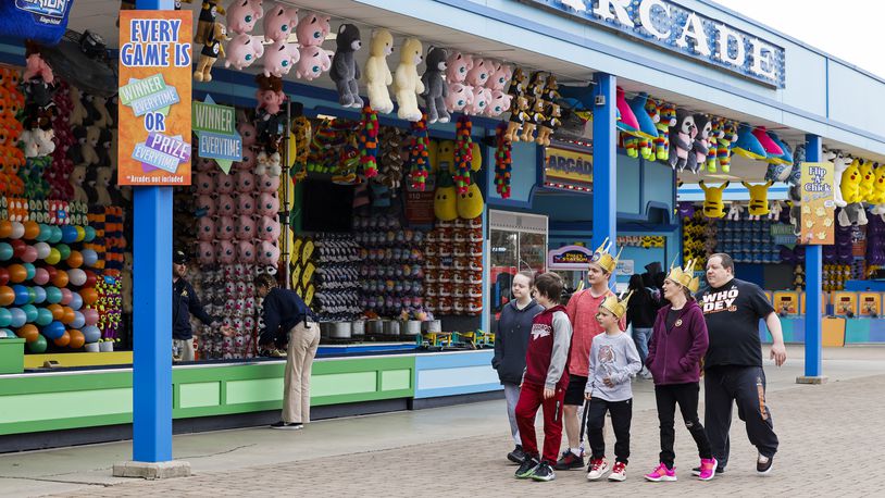 Visitors stroll through the games section after Kings Island held an opening ceremony and ribbon cutting Friday, April 29, 2022 in celebration of their 50th Anniversary. NICK GRAHAM/STAFF