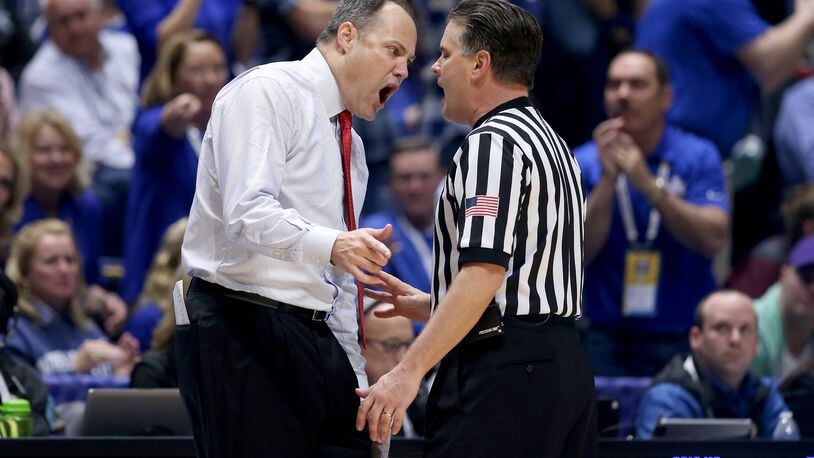 Georgia basketball coach Mark Fox can be animated with officials, but he seemed passive when an Auburn player joined his huddle during the late stages of Thursday night's game at Auburn.