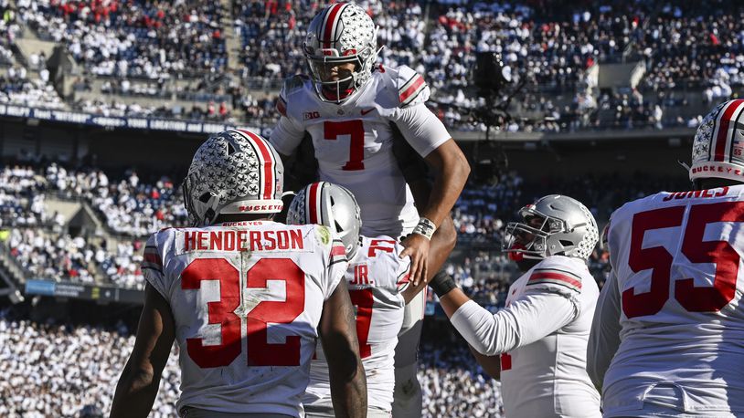 Ohio State quarterback C.J. Stroud (7) celebrates a touchdown with his teammates during the fourth quarter of an NCAA college football game against Penn State, Saturday, Oct. 29, 2022, in State College, Pa. Ohio State won 44-31. (AP Photo/Barry Reeger)