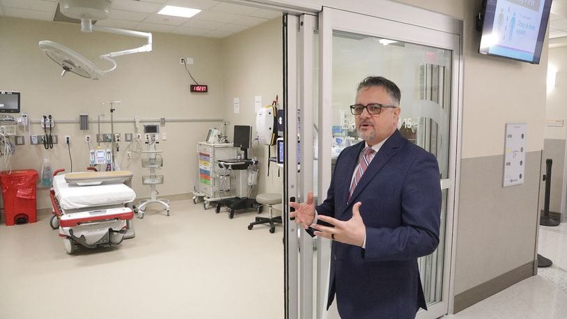 Ervin Gruia, administrator for the new Kettering Health Springfield, talks about the Emergency Department as he gives a tour of the new medical facility Friday, April 22, 2022. BILL LACKEY/STAFF