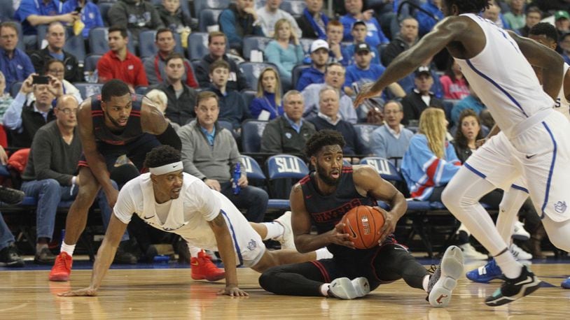 Dayton's Josh Cunningham grabs a loose ball in the final minute of the first half against Saint Louis on Tuesday, Feb. 5, 2019, at Chaifetz Arena in St. Louis.